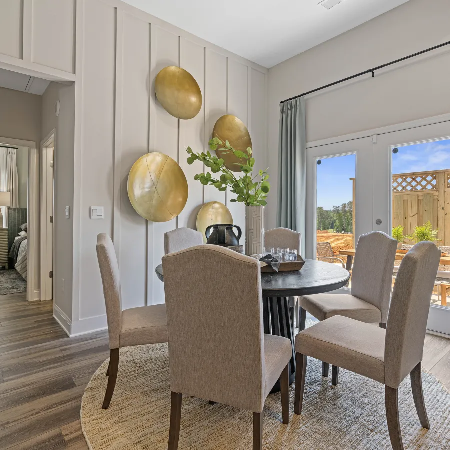 a dining room with a table and chairs