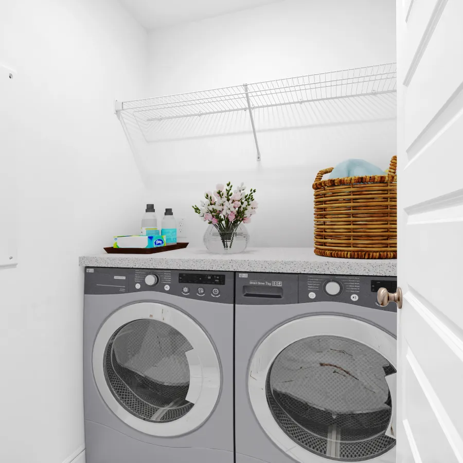 Modern laundry room with gray washers, shelves, a basket, and decorative flowers in a bright space.