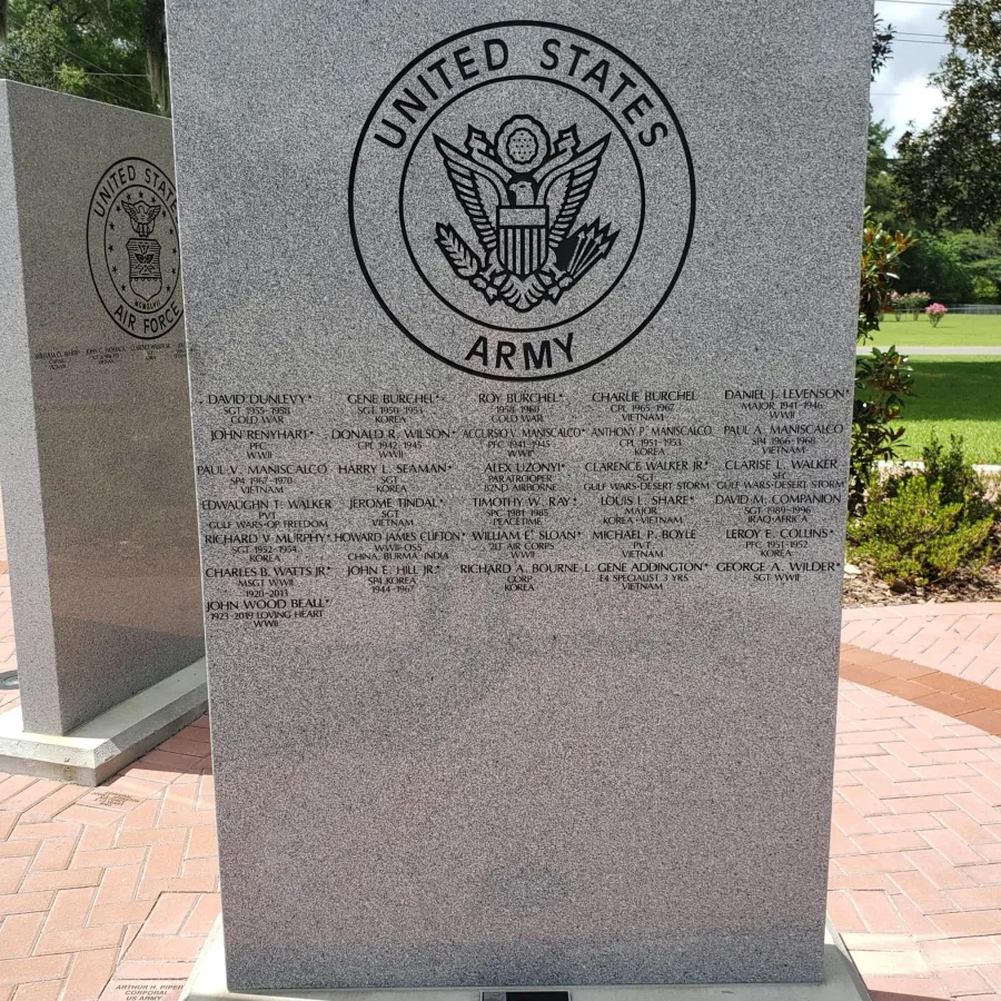 United States Army memorial stone engraved with names of soldiers and the Army emblem