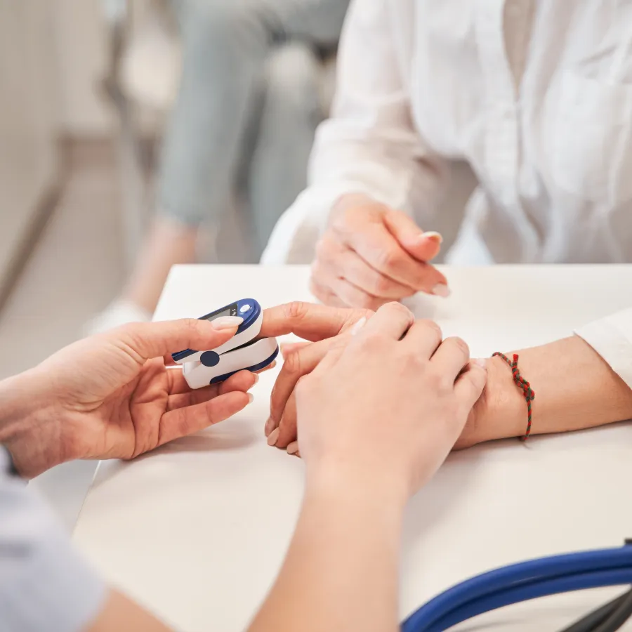 a doctor showing a patient something on the phone