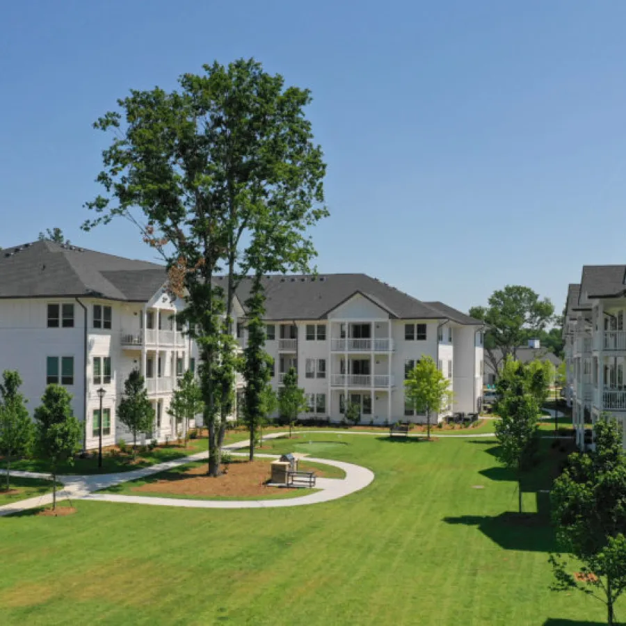 a large building with trees in front of it