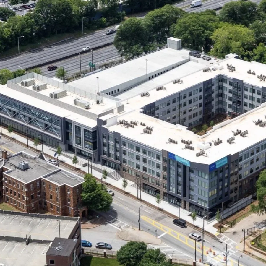 a large building with a parking lot