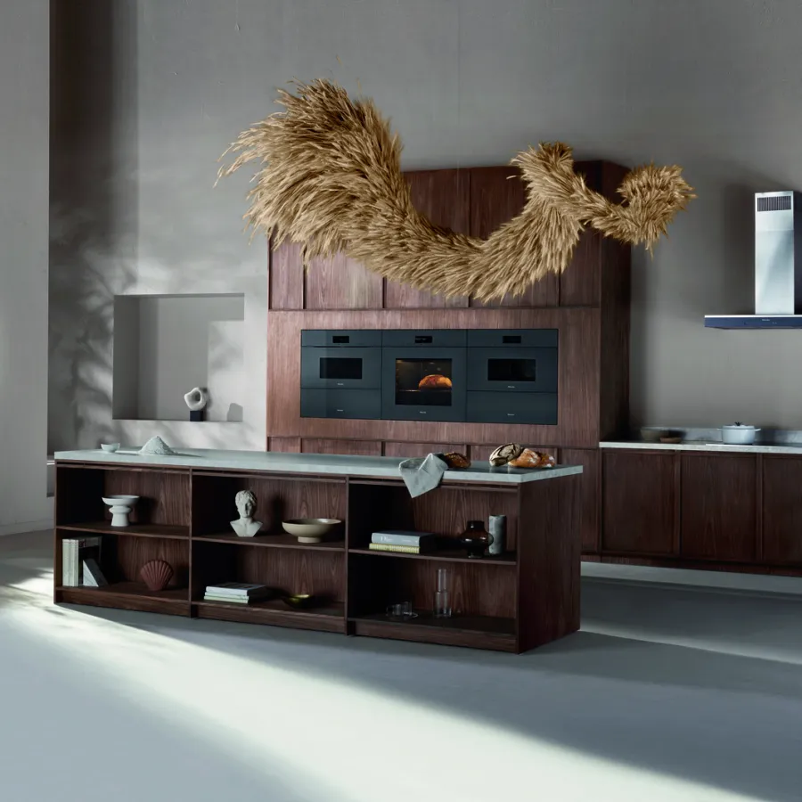 Modern kitchen design featuring wooden cabinetry and artistic decor.