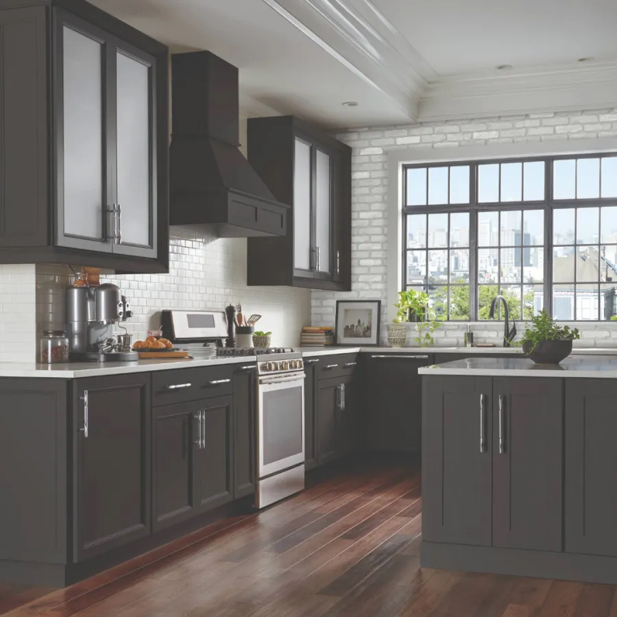 a kitchen with black cabinets