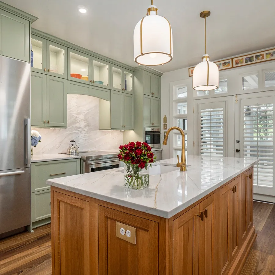 a kitchen with a marble island