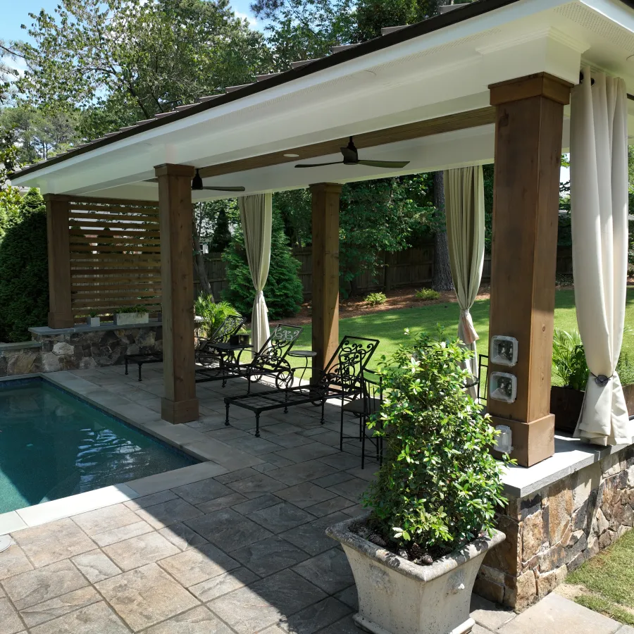 a pool with a covered patio