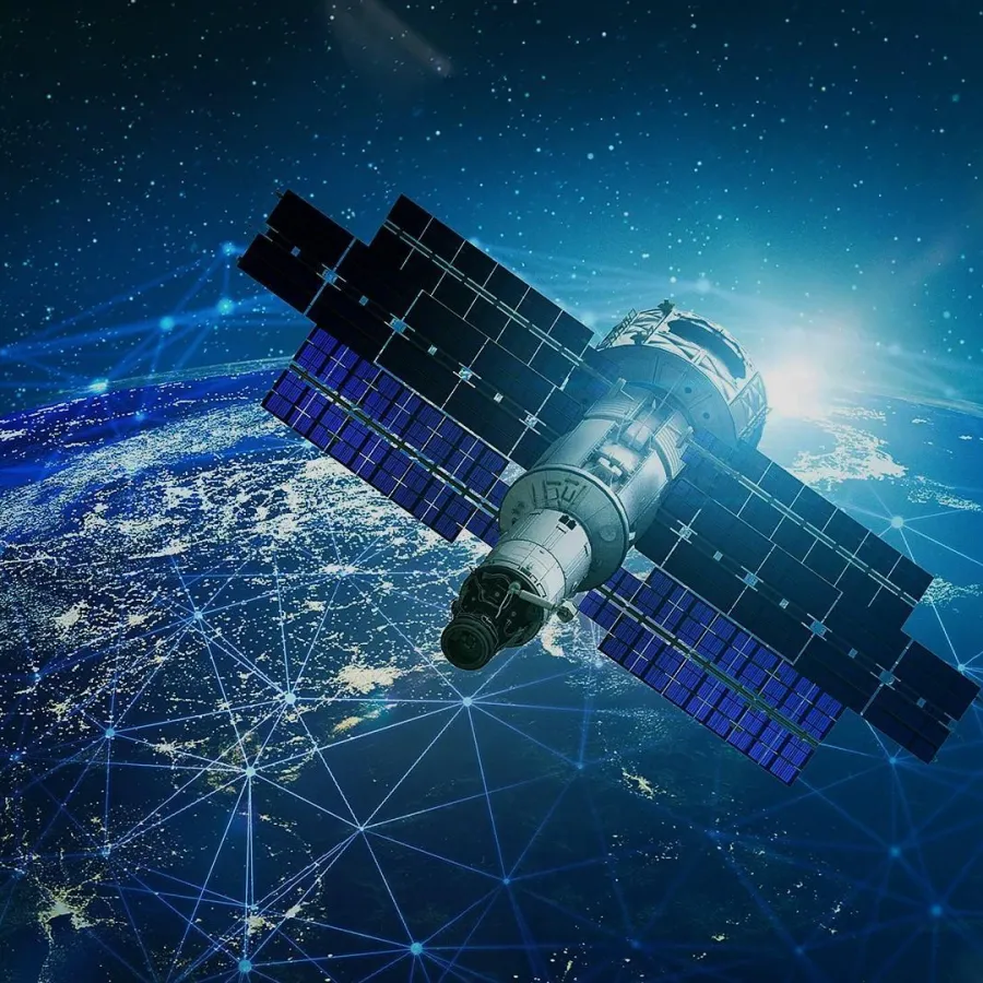 Satellite orbiting Earth with network connections and illuminated city lights visible on the planet's surface.