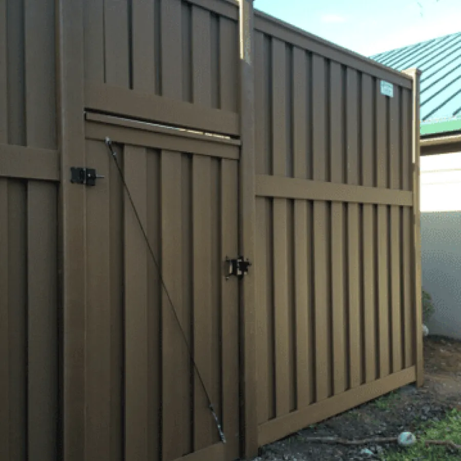 a wooden shed with a metal door