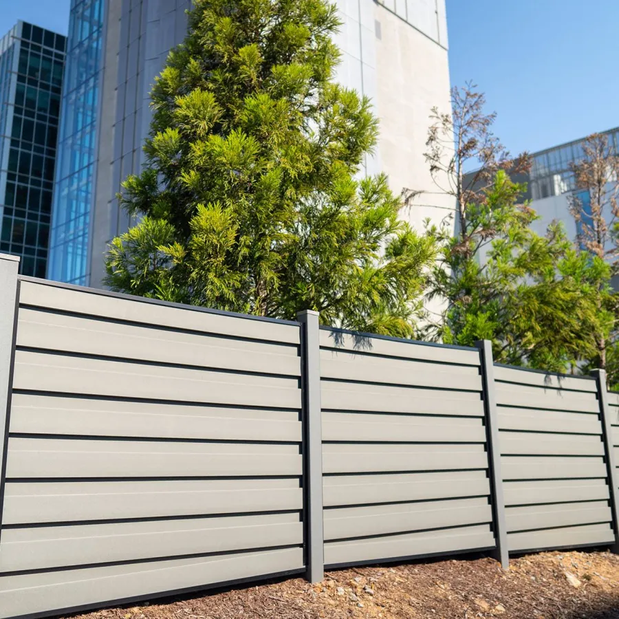 a white fence in front of a building