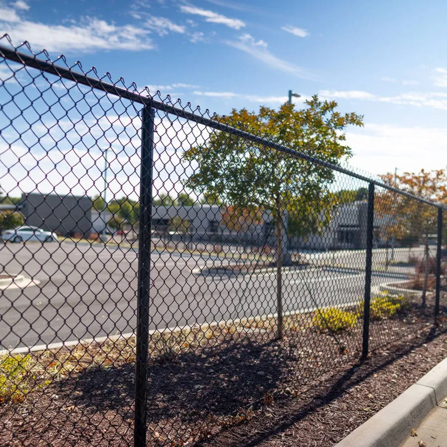 a fenced off area with a chain link fence and a street