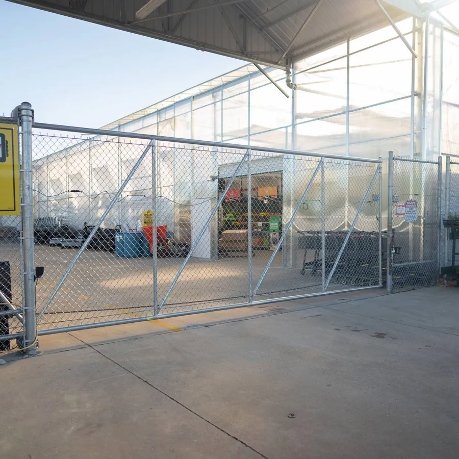 a metal gate with a metal fence