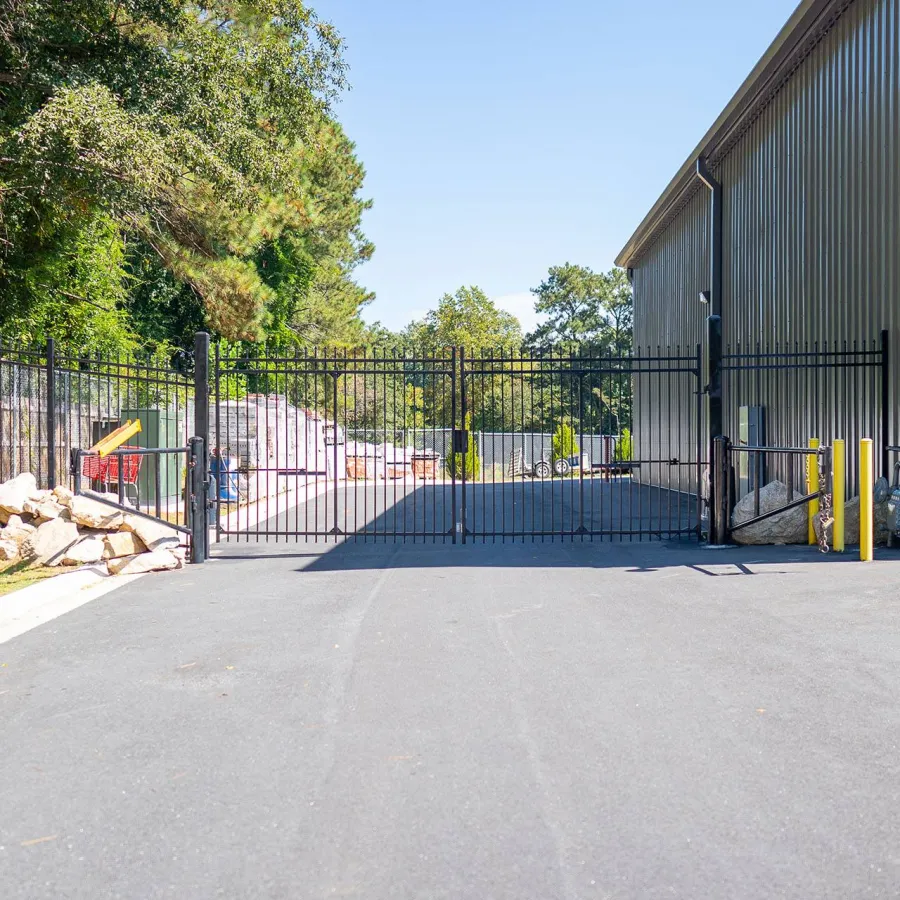 a road with a fence and trees