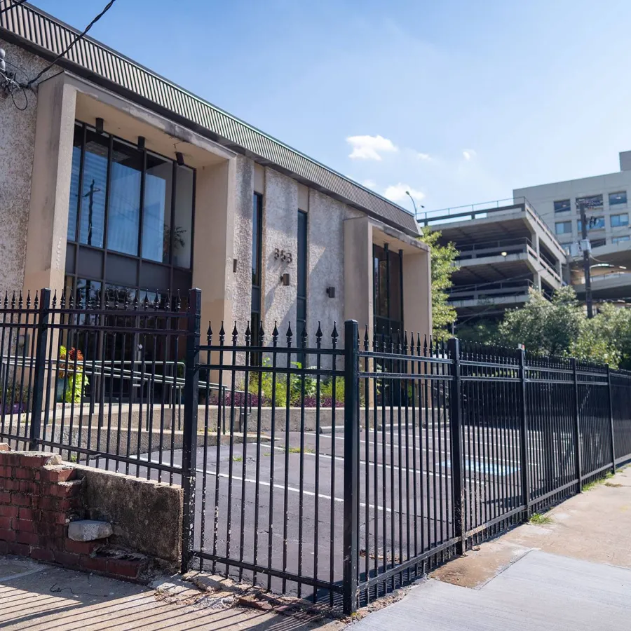 a building with a black fence