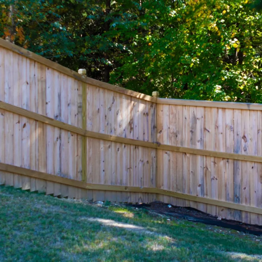 a wooden fence in a yard