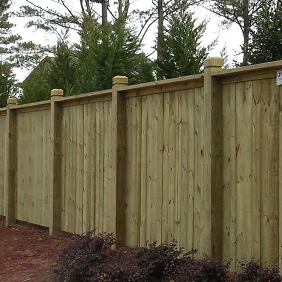 a wooden fence with a sign on it