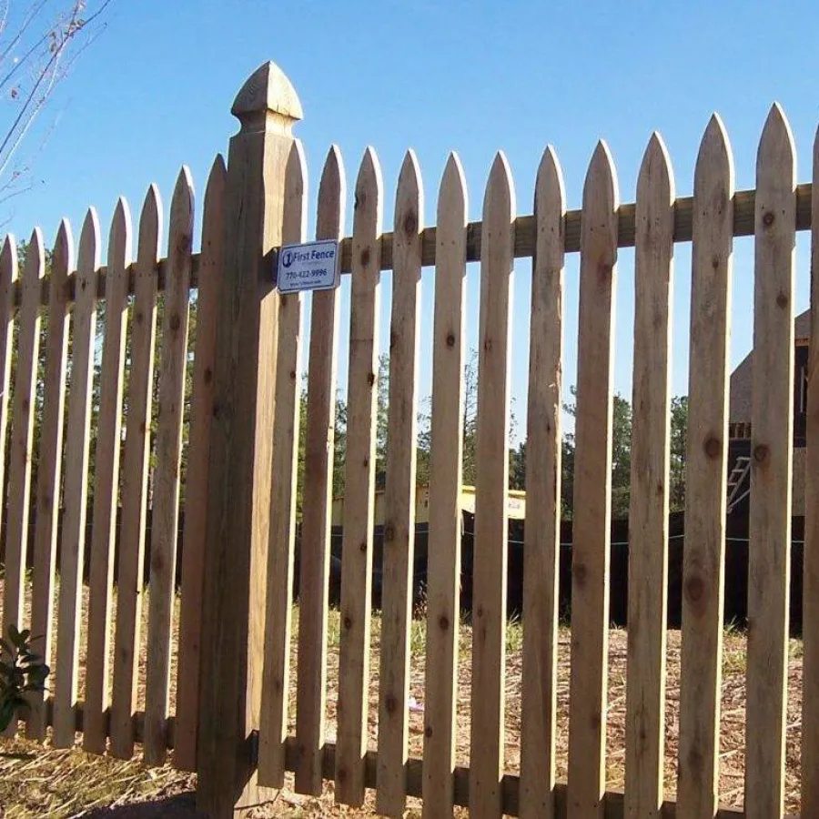 a wooden fence with a sign on it