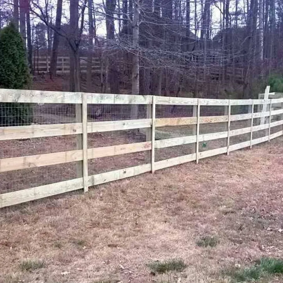 a white fence in a field