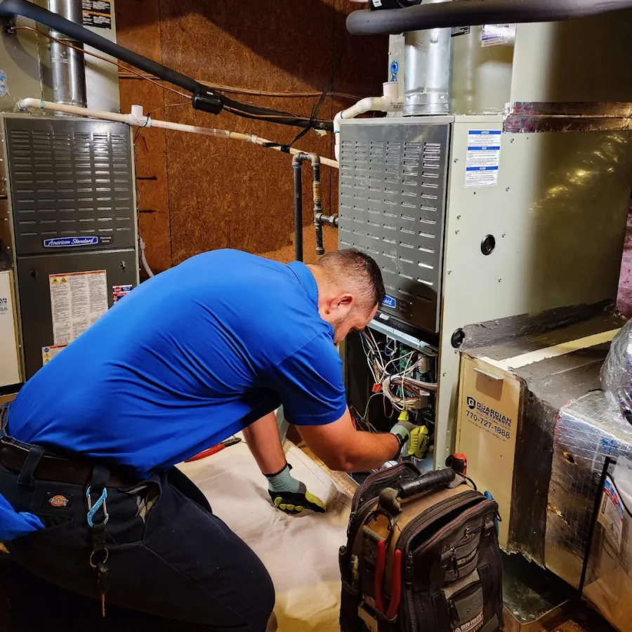 a man working on a furnace