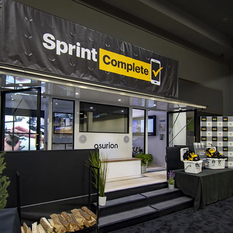 Sprint Complete service booth with promotional displays and products at a trade show or event indoor setting.