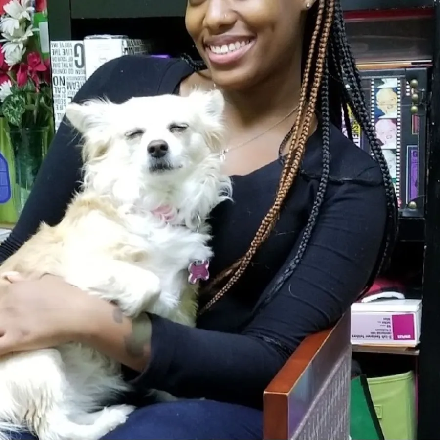 a woman holding a dog