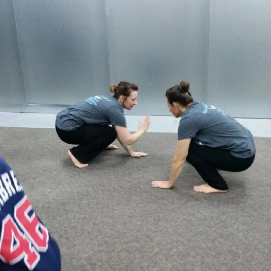 a group of people kneeling on the floor