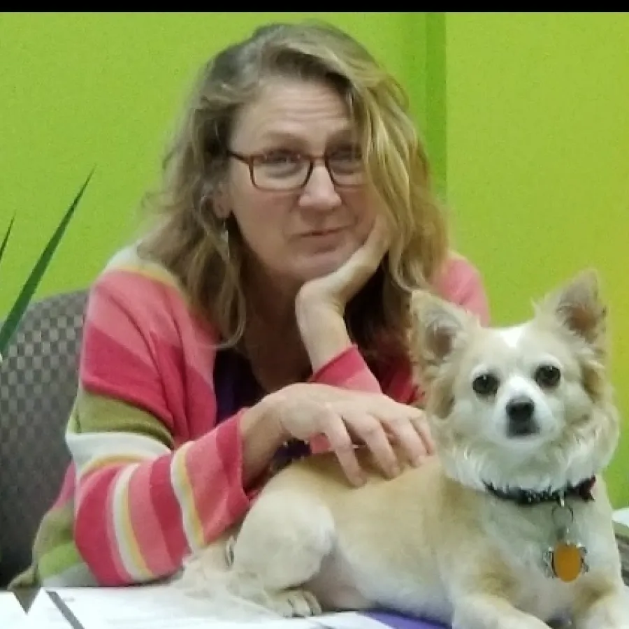 a woman holding a dog