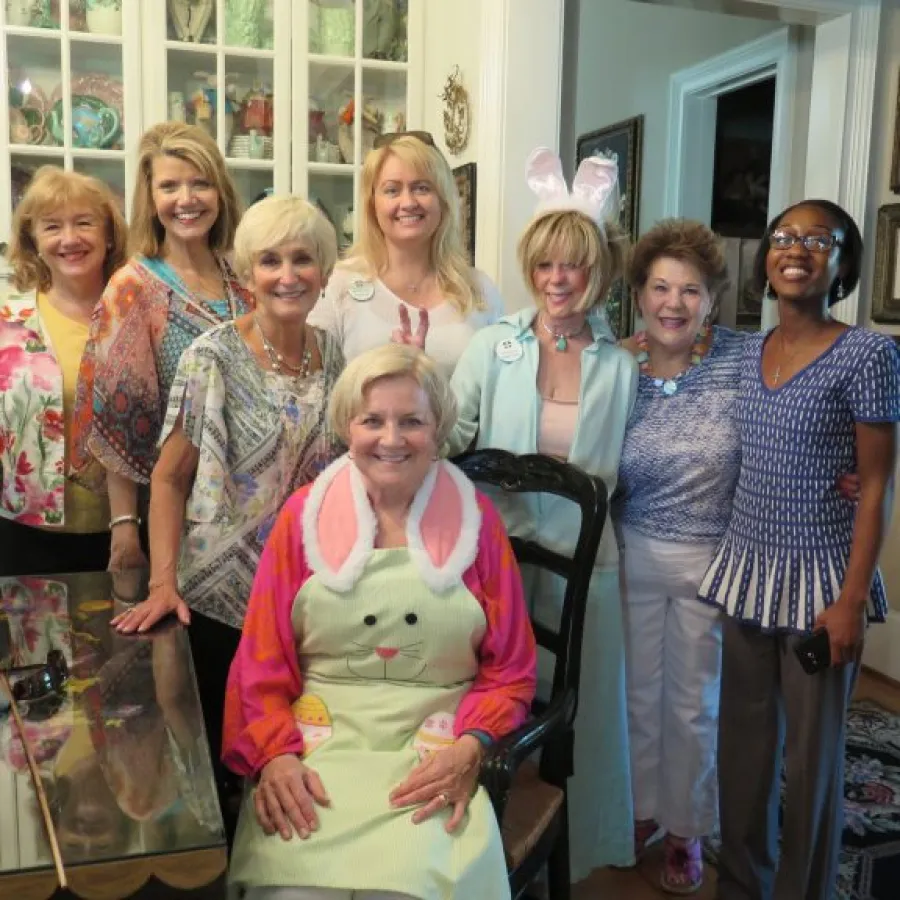 a group of women posing for a photo