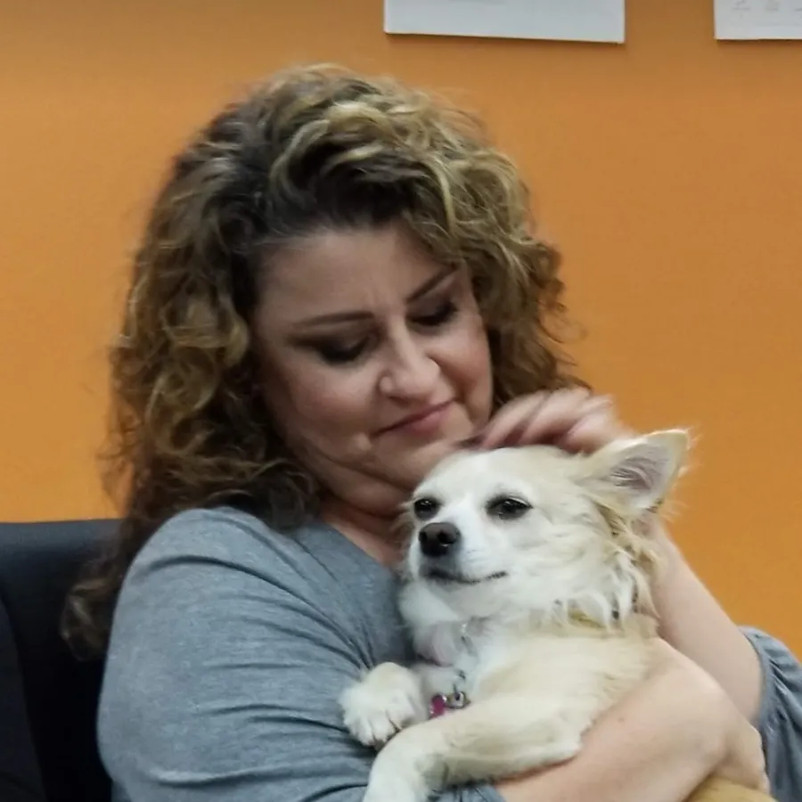 a person holding a dog