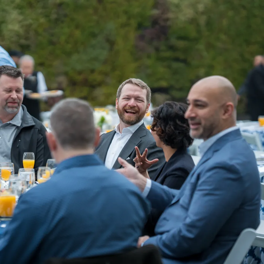 a group of people sitting at tables