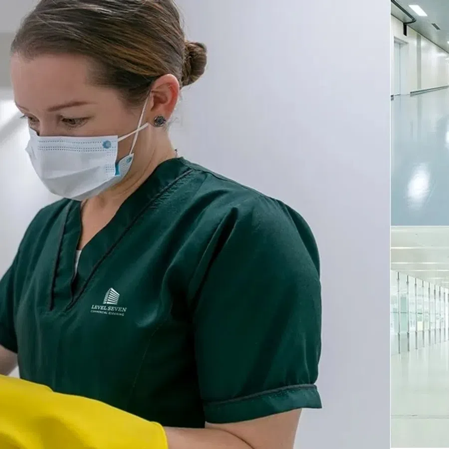Cleaning staff wearing masks and gloves sanitizing hospital surfaces and corridors for hygiene and safety.