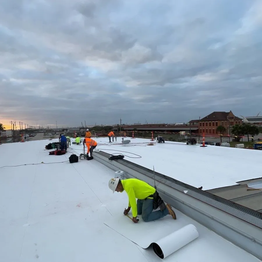 a group of people working on a roof