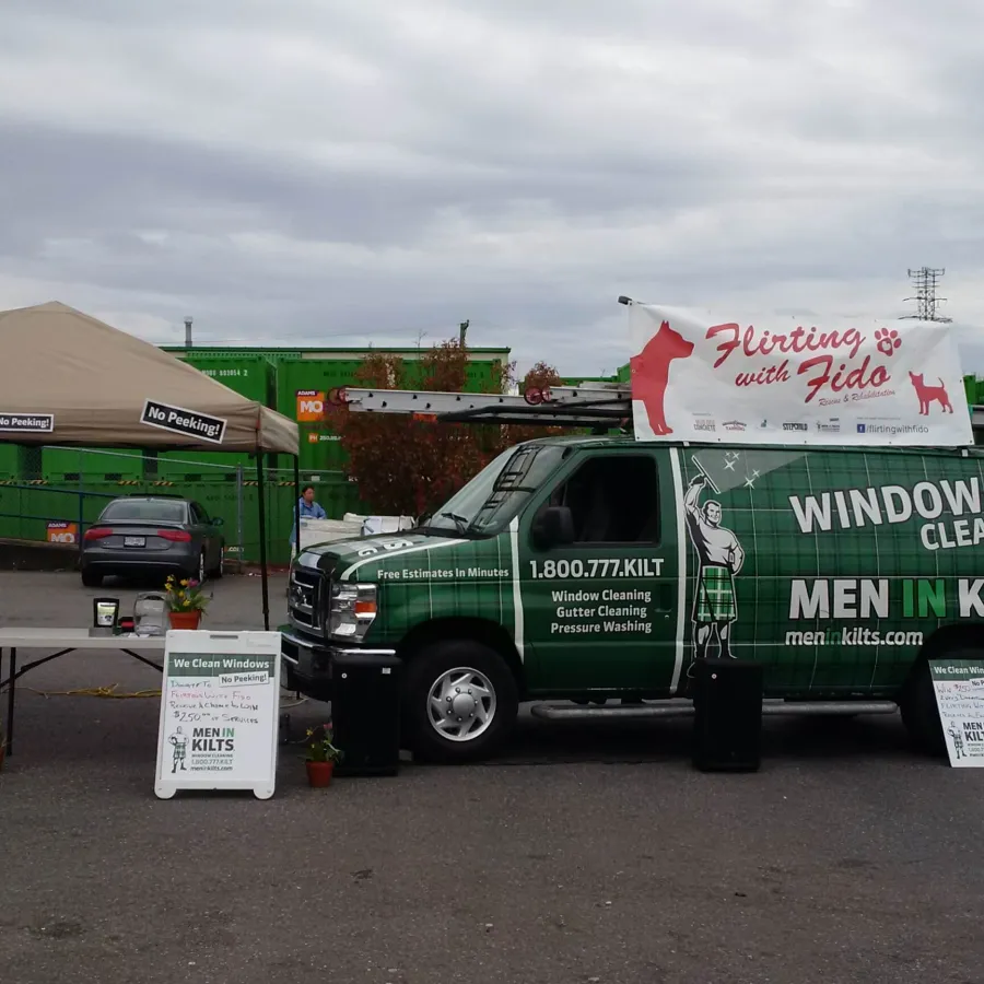 a green truck parked in a parking lot