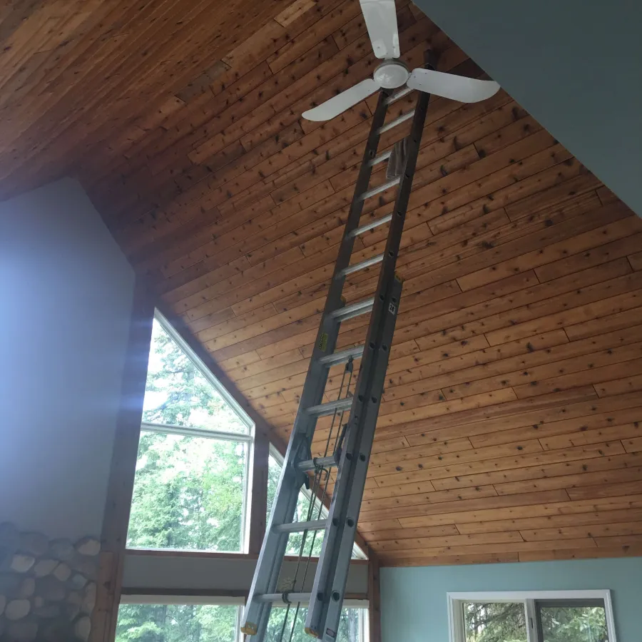 a ladder next to a window