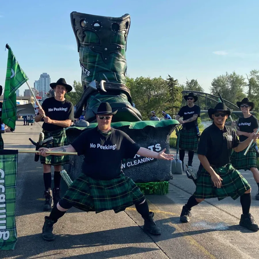 a group of people in kilts playing drums