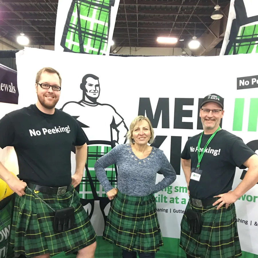 a group of people wearing kilts