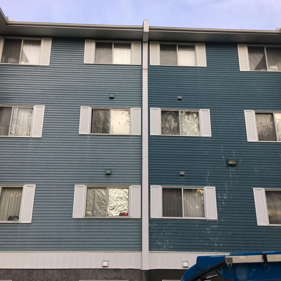 a blue building with windows