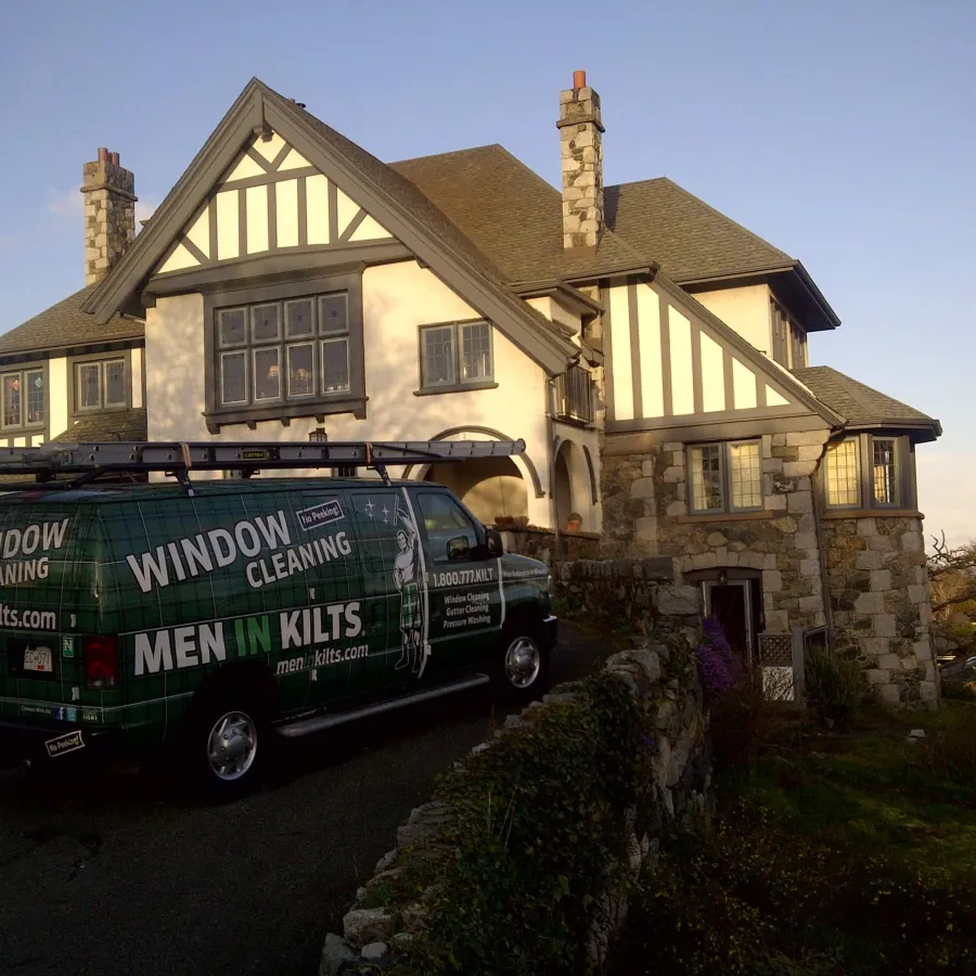 a van parked in front of a house