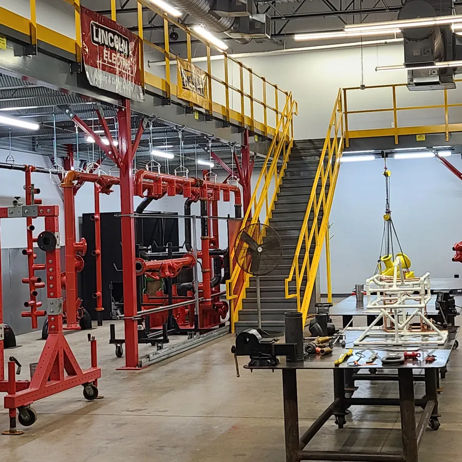 a large room with red and yellow machinery