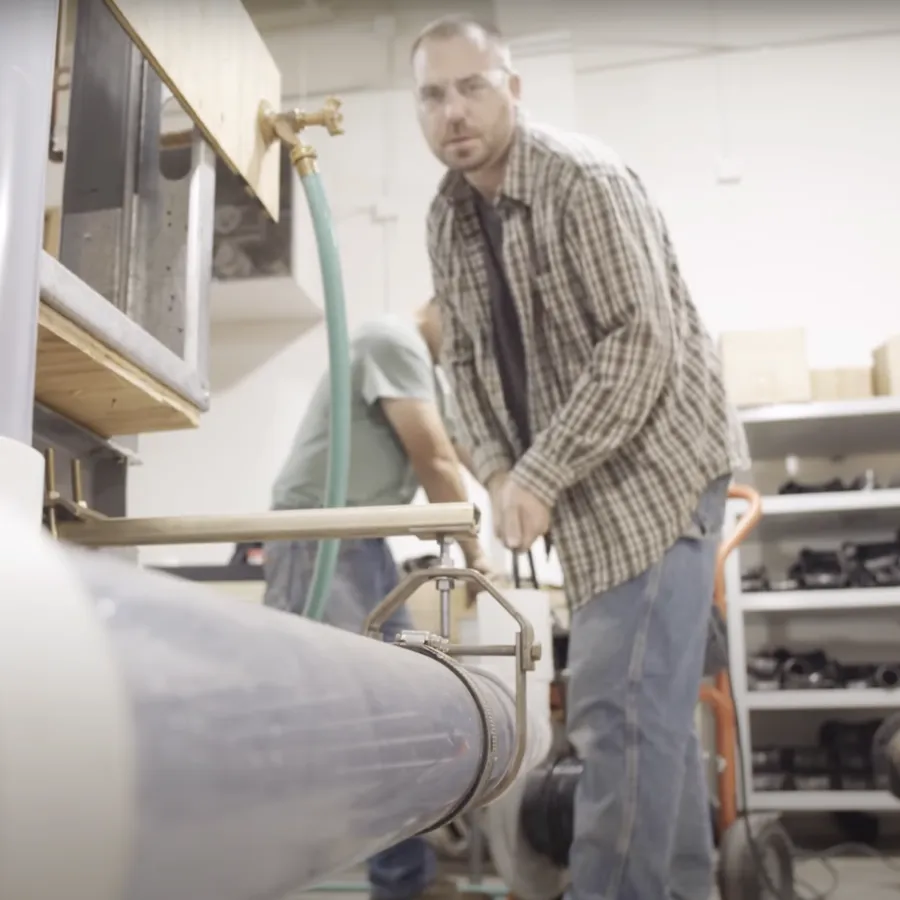 a person holding a green tube