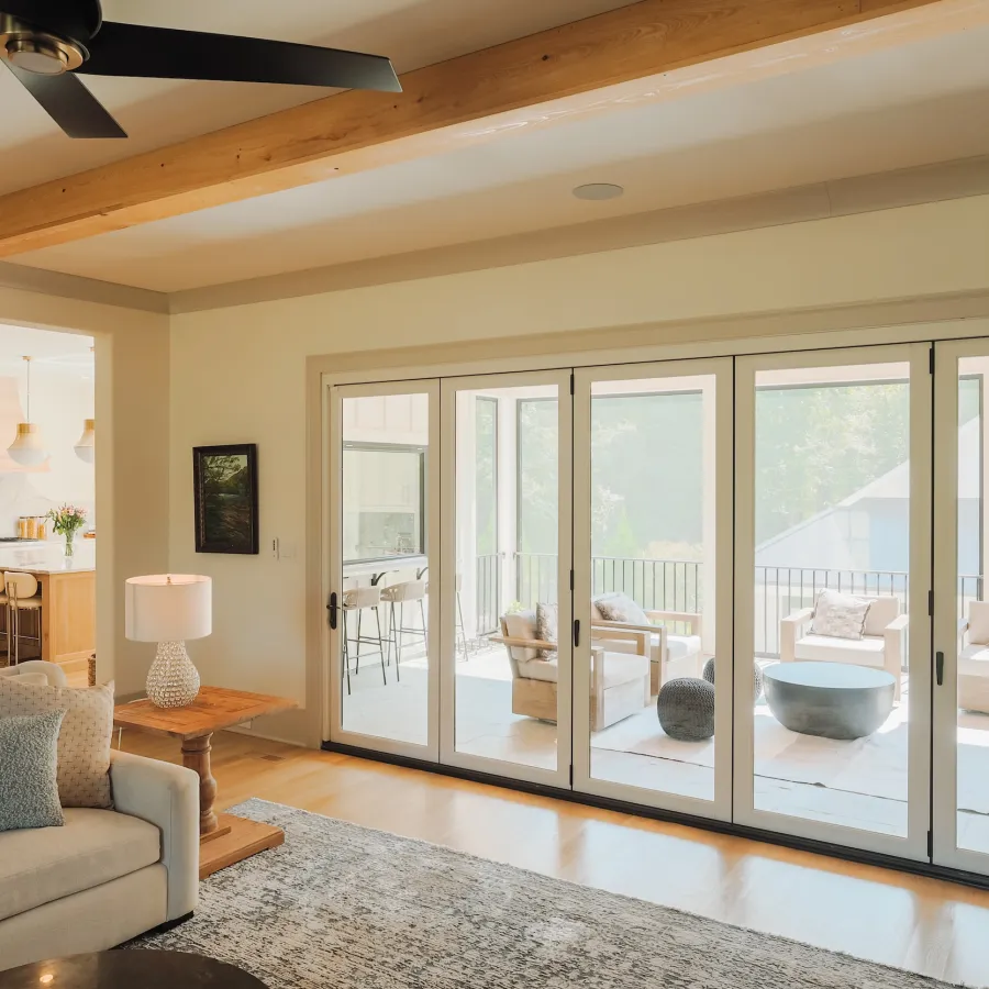 Bright living room with a bi-folding fiberglass patio door