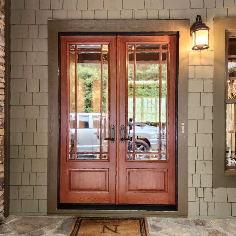 Double craftsman style entry doors by ProVia installed on green shingle house by North Georgia Replacement Windows