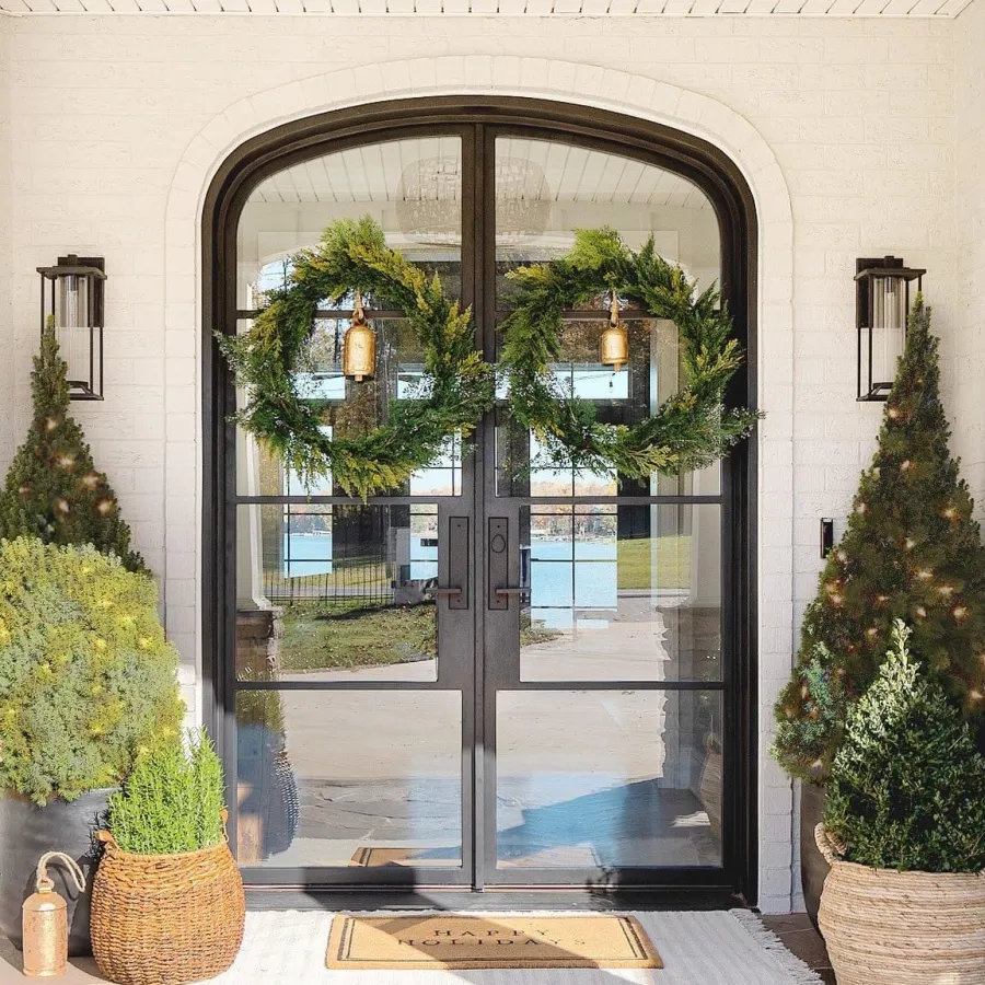 Glass double front doors with thin black iron frame for a modern design