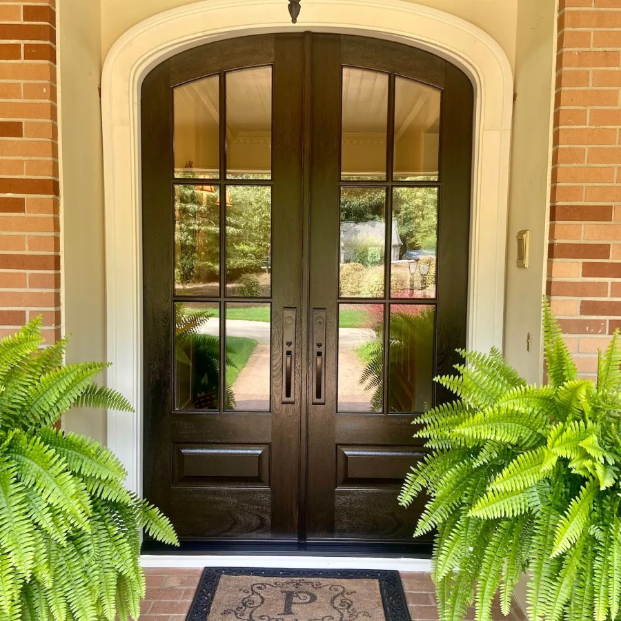 French style double front doors on brick house