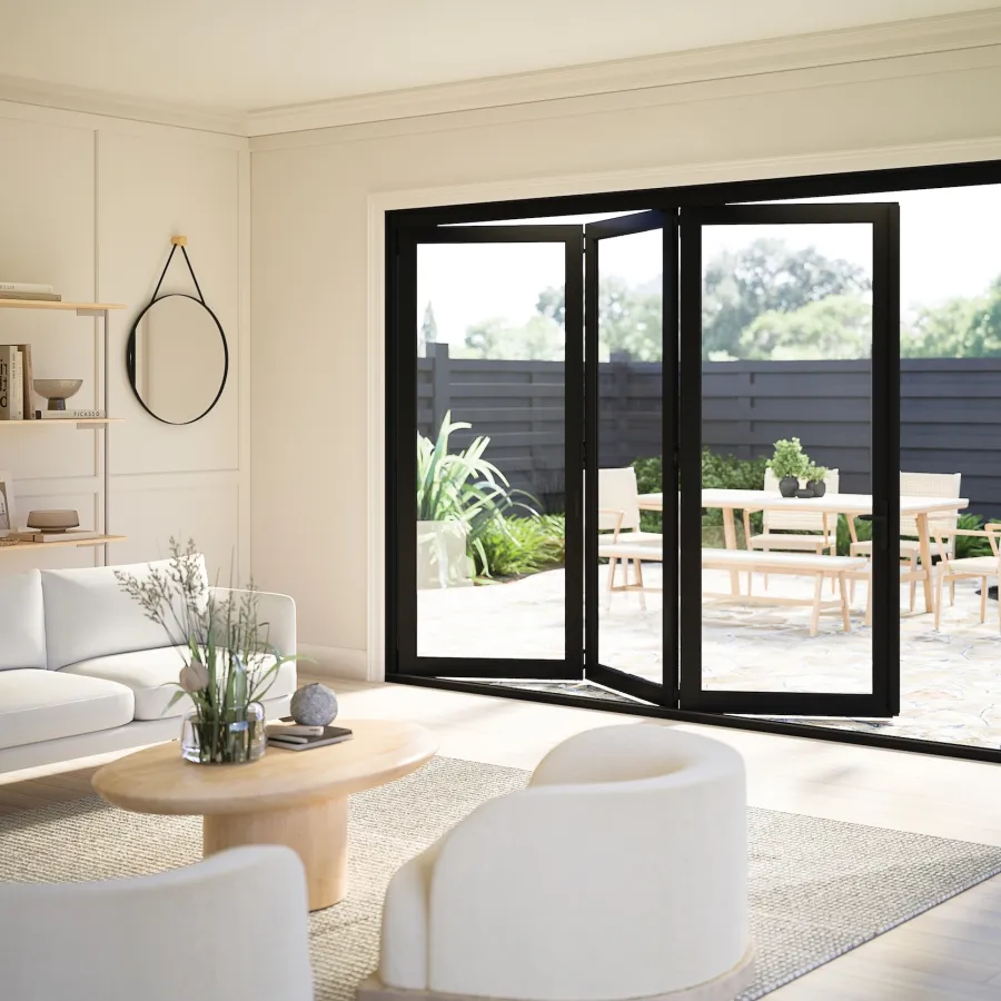 Modern white living room with partially open black bifold door leading to patio