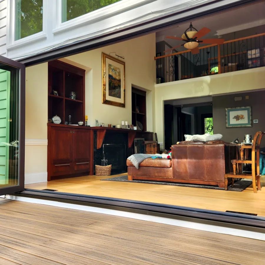 Bifold patio door opens living room to outdoor deck