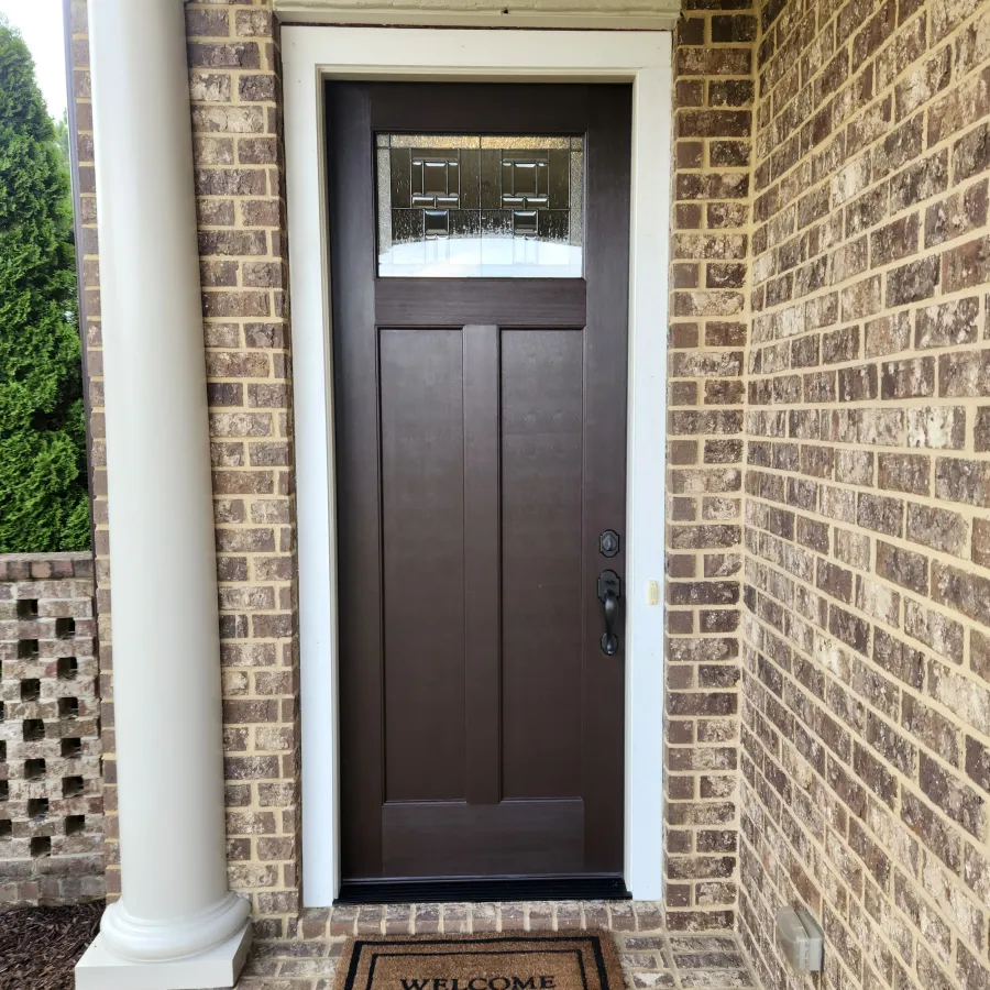 Craftsman style front door with decorative glass