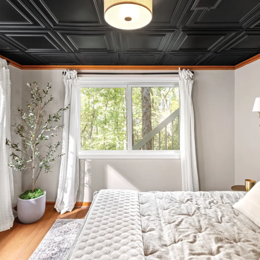 a bedroom with a large window