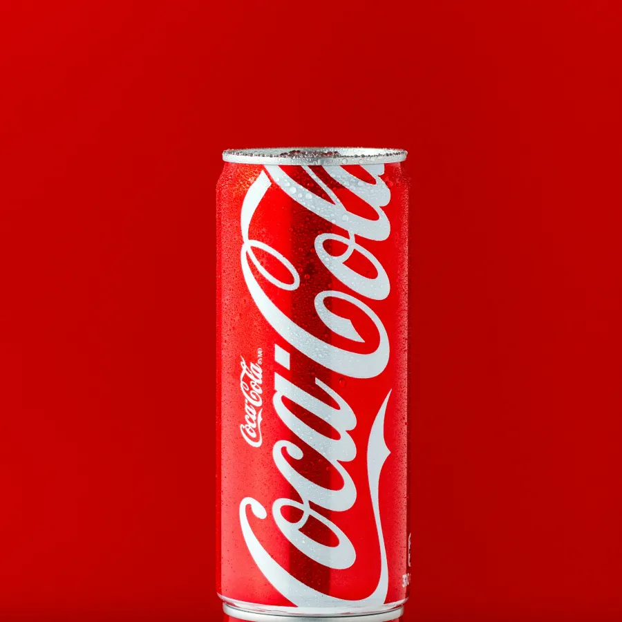 a red and white can of soda
