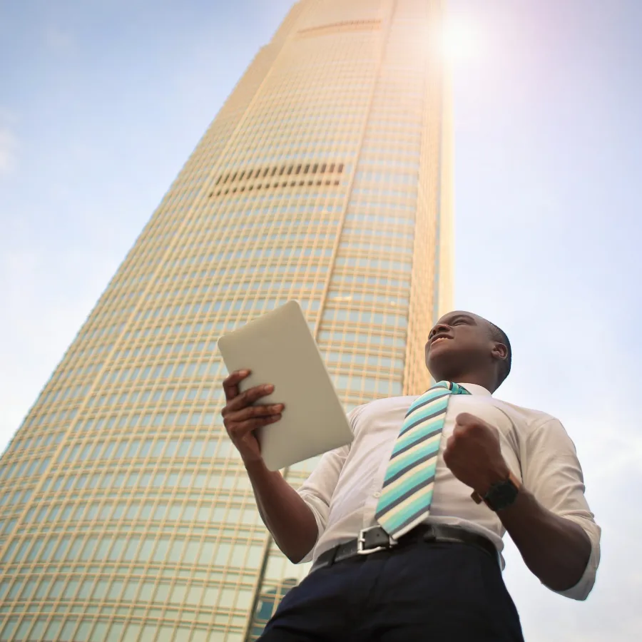 a man holding a laptop
