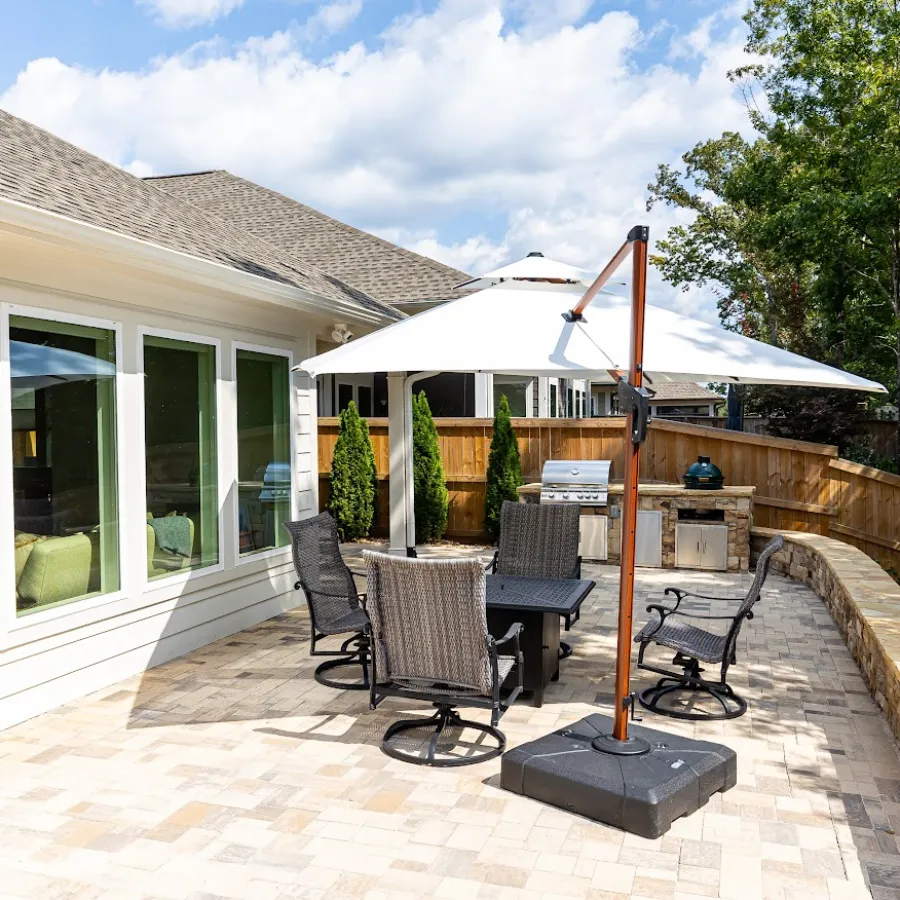 a patio with chairs and a table